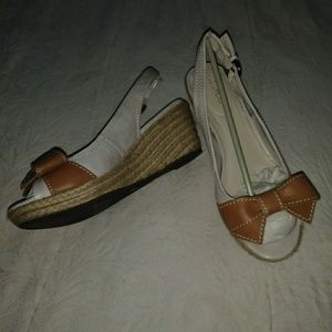 Nude wedges with a cute  bow at front .